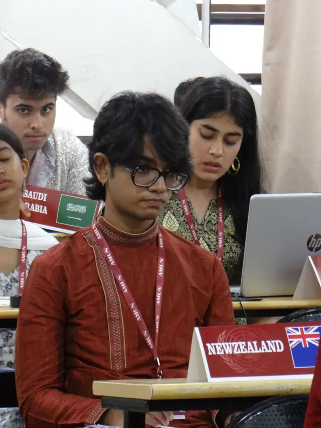 The delegate of New Zealand at their desk.