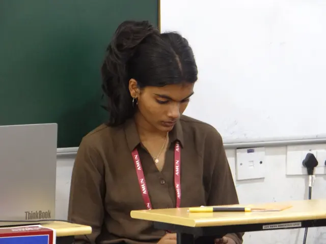 A delegate reads through their notes.